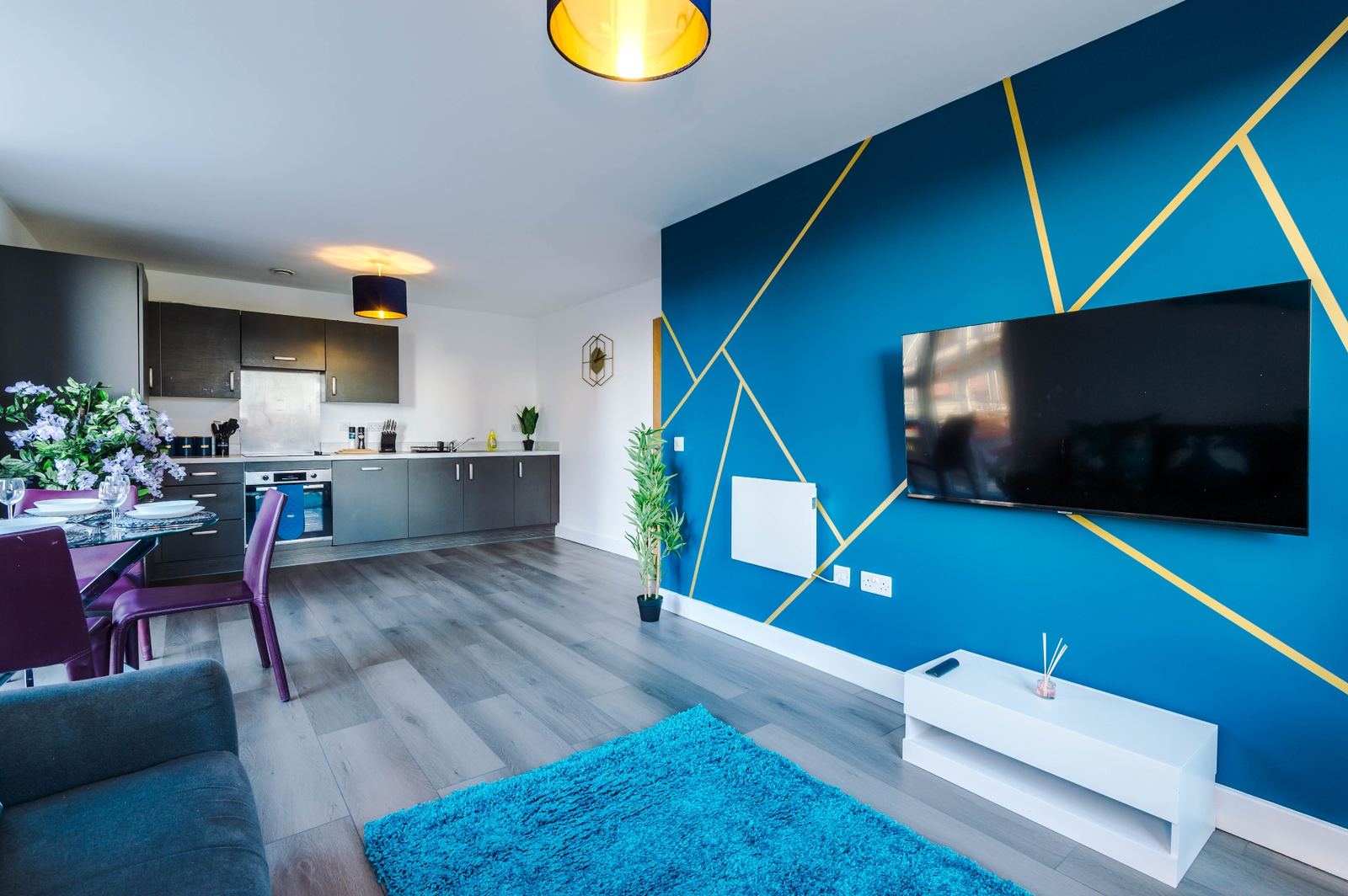 Bridgewater open-plan living and kitchen with geometric feature wall